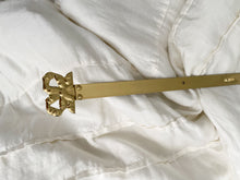 Load image into Gallery viewer, Brass bow painting or plate hanger